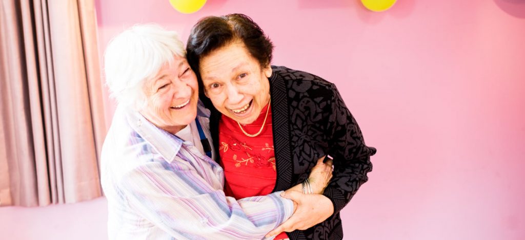 Doutta Galla Queens Park aged care - two senior ladies smiling and embracing