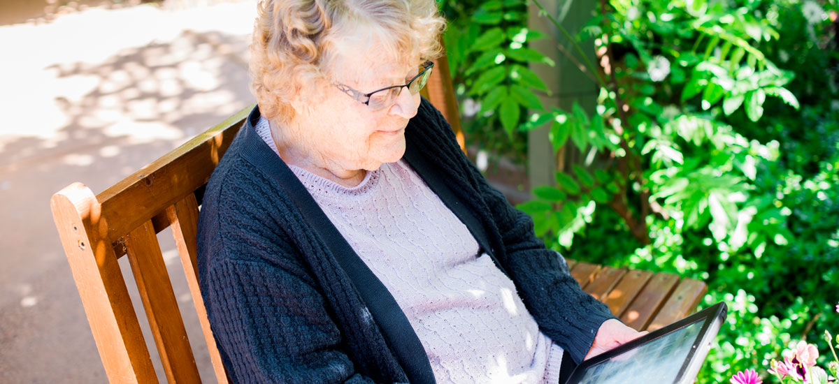 Doutta Galla Yarraville - senior lady reading outside